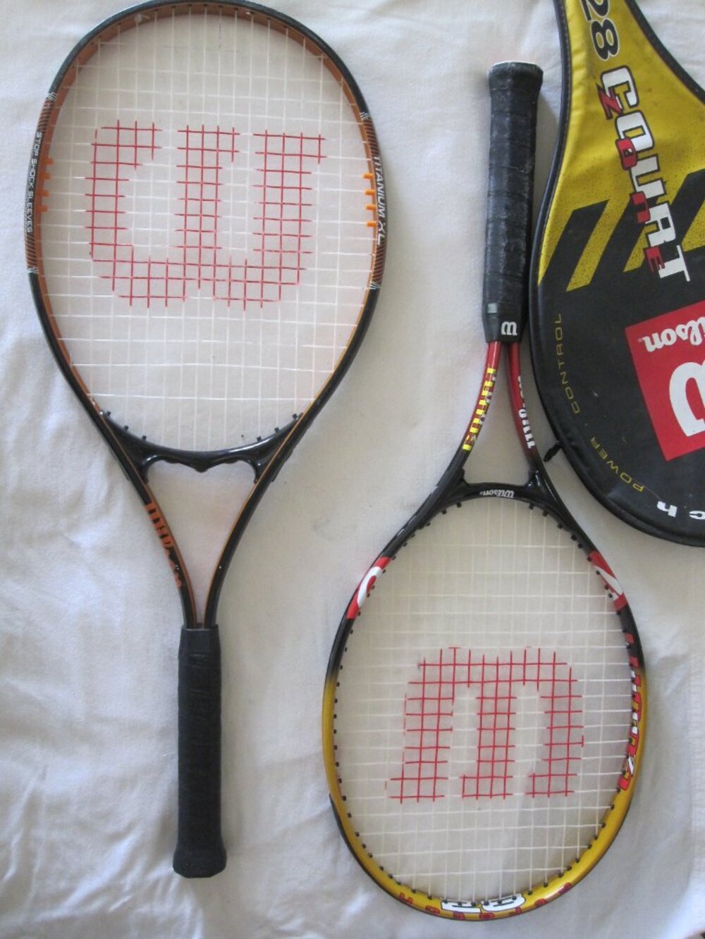 (2) Wilson Tennis Racquets: 28 Court Zone & Titanium Xl